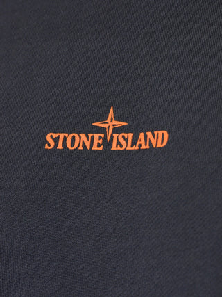Stone Island graphic-print sweatshirt. Iconic Compass motif, chest logo, and premium cotton. Timeless utility style. Available at our Lisbon store.