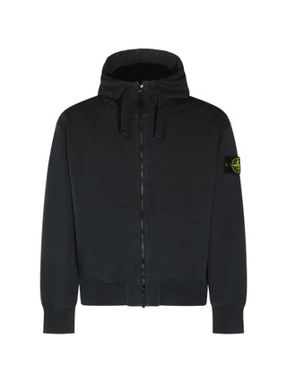 Stone Island hooded jacket with signature Compass patch. Drawstring hood, front zip fastening, and elasticated cuffs. Available at our Lisbon store. 