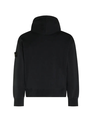 Stone Island hooded jacket with signature Compass patch. Drawstring hood, front zip fastening, and elasticated cuffs. Available at our Lisbon store. 