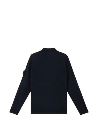 Logo-patch wool sweater from Stone Island. Ribbed crewneck and detachable emblem. Soft, luxurious wool for effortless layering. Available at our Lisbon store.