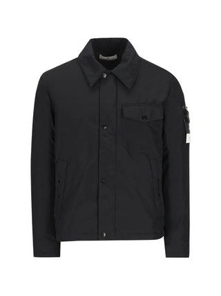 Stone Island zip jacket with detachable Compass badge. Crafted from cotton, nylon, or stretch poplin. Available at our Lisbon store. 