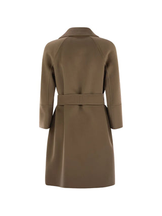 Belted virgin wool coat by 'S Max Mara. Notched lapels, side slit pockets, and an adjustable waist. A timeless investment available at our Lisbon store.