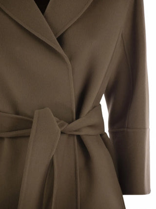 Belted virgin wool coat by 'S Max Mara. Notched lapels, side slit pockets, and an adjustable waist. A timeless investment available at our Lisbon store.