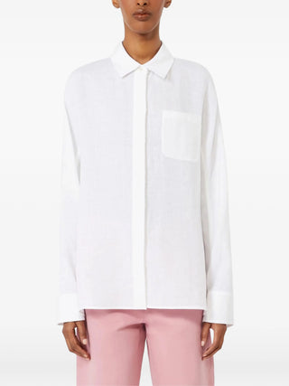 'S Max Mara shirt with chest patch pocket. Long sleeves, buttoned cuffs, and a straight hem. A modern wardrobe staple, available at our Lisbon store.