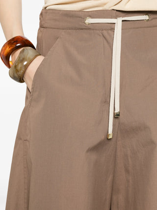 'S Max Mara palazzo pants. Wide-leg silhouette with a drawstring waist, side pockets, and a flowing fit. Italian craftsmanship. Available at our Lisbon store.