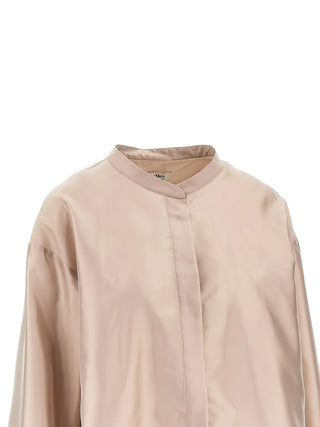 Helene shirt by 'S Max Mara. Band collar and stepped hem create a modern silhouette. Perfect for elevated everyday wear. Available at our Lisbon store.