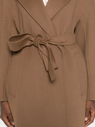 Penelope belted coat by 'S Max Mara. Notched lapels, long kimono sleeves, and welt pockets. A timeless investment, available at our Lisbon store. 