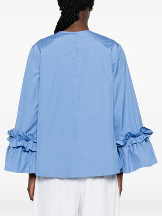 'S Max Mara Valzer blouse. Pure cotton poplin, round neck, long sleeves, and rear snap-button fastening. A wardrobe essential, available at our Lisbon store.