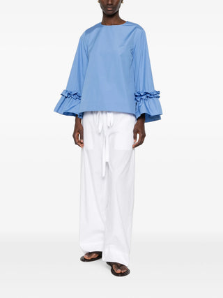 'S Max Mara Valzer blouse. Pure cotton poplin, round neck, long sleeves, and rear snap-button fastening. A wardrobe essential, available at our Lisbon store.
