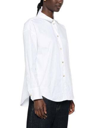 'S Max Mara Volonta shirt. Asymmetric hem, jewel buttons, and pure cotton. A modern classic with deep side slits. Available at our Lisbon store.