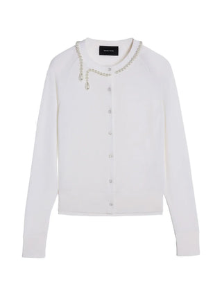 Simone Rocha white merino silk cardigan with faux-pearl detail and button front. Timeless, refined layer available at our Lisbon store.