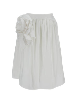 Simone Rocha white rosette basque skirt with floral embellishments and gathered design. Feminine and elegant, available at our Lisbon store.