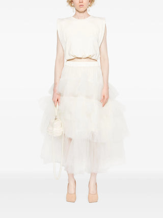 Simone Rocha white tulle midi skirt with ruffled overlay and flared hem. Elegant and effortless, available at our Lisbon store.