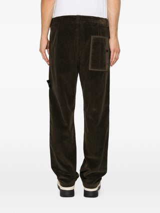 Compass-motif corduroy trousers from Stone Island. Premium cotton with a straight-leg silhouette, belt loops, and a button-zip fly. Iconic side patch. 