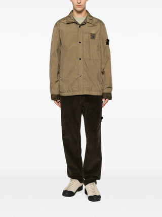 Compass-motif corduroy trousers from Stone Island. Premium cotton with a straight-leg silhouette, belt loops, and a button-zip fly. Iconic side patch. 