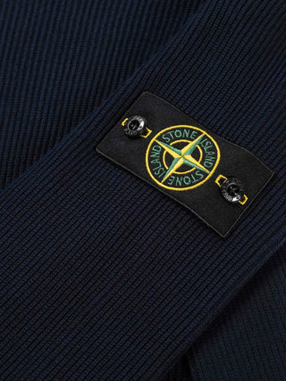 Compass-patch ribbed-knit sweater from Stone Island. Relaxed fit, crew neck, and premium fabric. Effortless style. Available at our Lisbon store.