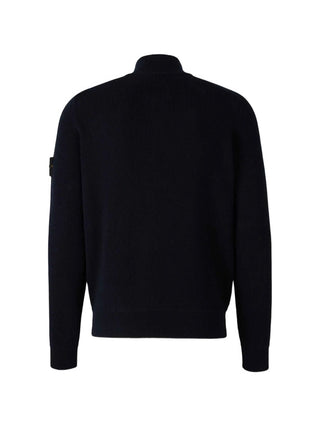 High-neck sweater from Stone Island. Ribbed mock neck, long sleeves, and iconic logo badge. Classic utilitarian warmth. Available at our LIsbon store. 