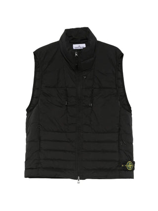 Stone Island quilted gilet with signature Compass logo-patch. Water-resistant shell and down fill for warmth. An utilitarian icon found at our Lisbon store. 