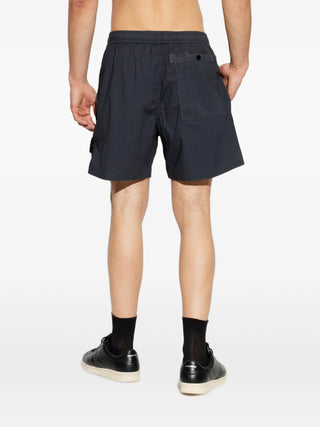 Logo-patch shorts from Stone Island. Crafted from premium cotton or nylon with elasticated or button waist. Iconic side badge. Available at our Lisbon store.