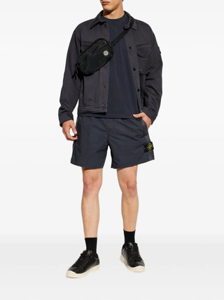 Logo-patch shorts from Stone Island. Crafted from premium cotton or nylon with elasticated or button waist. Iconic side badge. Available at our Lisbon store.