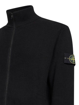 Stone Island's ribbed cardigan. Defined by its collar, premium fabric, and detachable Compass motif. Functional style redefined. Available at our Lisbon store.