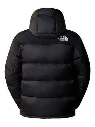 Himalayan hooded puffer by The North Face. Crafted from recycled materials with 550-fill down insulation. Water-repellent and windproof, with a adjustable hood.