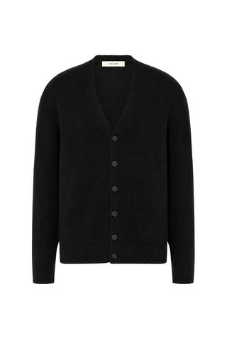 The Row V-neck cardigan in cashmere. Relaxed fit with black front buttons and long sleeves. Made in Italy. A quiet-luxury staple, available at our Lisbon store.