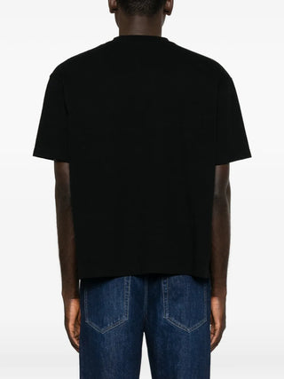 The Row Madoc cotton jersey t-shirt. Boxy fit, ribbed crew neck, and a straight hem. A refined everyday essential. Available at our Lisbon store.