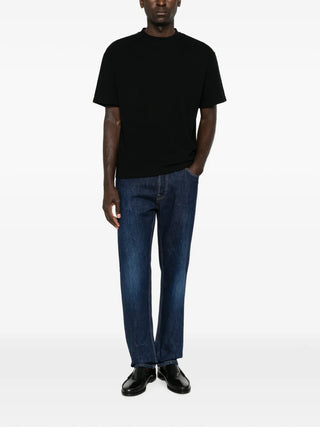 The Row Madoc cotton jersey t-shirt. Boxy fit, ribbed crew neck, and a straight hem. A refined everyday essential. Available at our Lisbon store.