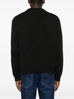 THE ROW Markhim sweater. Italian-made cashmere knit with a ribbed texture and a modern melange finish.  Available at our Lisbon store.