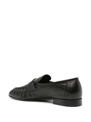 The Row Soft Loafer in paneled lambskin leather. Features artisanal pleating and a hand-painted leather sole. Available at our Lisbon store.