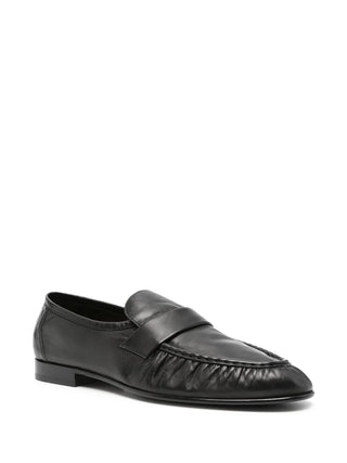 The Row Soft Loafer in paneled lambskin leather. Features artisanal pleating and a hand-painted leather sole. Available at our Lisbon store.