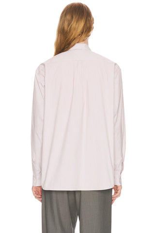 The Row Vanja shirt in striped lightweight cotton. Button-up with patch pocket, pointed collar, and mother-of-pearl buttons.  Available at our Lisbon store.