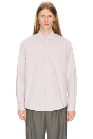 The Row Vanja shirt in striped lightweight cotton. Button-up with patch pocket, pointed collar, and mother-of-pearl buttons.  Available at our Lisbon store.