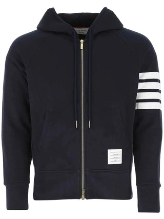 Classic Loopback Full Zip Hoodie by Thom Browne. 4-Bar stripe detailing, silver-tone 2-way zip, and signature grosgrain loop tab. Available at our Lisbon store. 