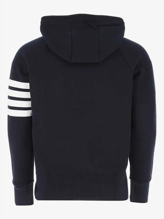 Classic Loopback Full Zip Hoodie by Thom Browne. 4-Bar stripe detailing, silver-tone 2-way zip, and signature grosgrain loop tab. Available at our Lisbon store. 