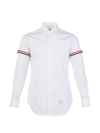 Thom Browne classic button-down shirt. Oxford cotton, 4-Bar detailing, and impeccable Italian craftsmanship. Available at our Lisbon store. 
