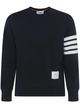 Classic navy sweatshirt by Thom Browne. Crew neck, 4-Bar motif, buttoned side vents, and tricolor grosgrain trim. Available at our Lisbon store. 