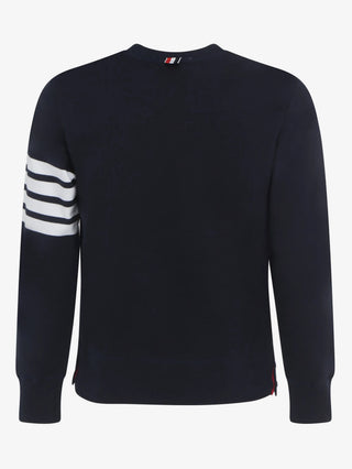Classic navy sweatshirt by Thom Browne. Crew neck, 4-Bar motif, buttoned side vents, and tricolor grosgrain trim. Available at our Lisbon store. 