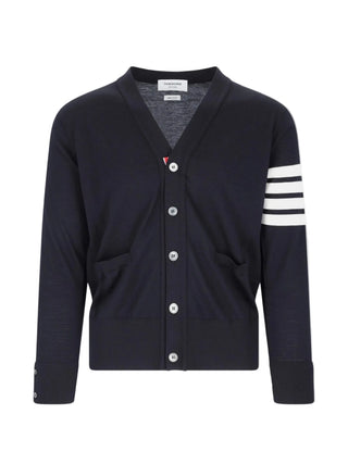 Thom Browne Classic V-Neck Cardigan. Signature 4-Bar stripe, striped grosgrain placket, and front patch pockets. Available at our Lisbon store.