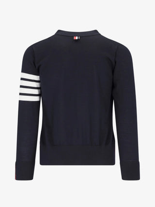 Thom Browne Classic V-Neck Cardigan. Signature 4-Bar stripe, striped grosgrain placket, and front patch pockets. Available at our Lisbon store.