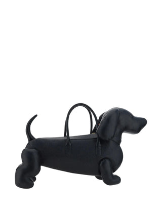 This sculptural Hector bag, inspired by Thom Browne's beloved dachshund, crafted in fine materials and finished with the brand's iconic design codes.