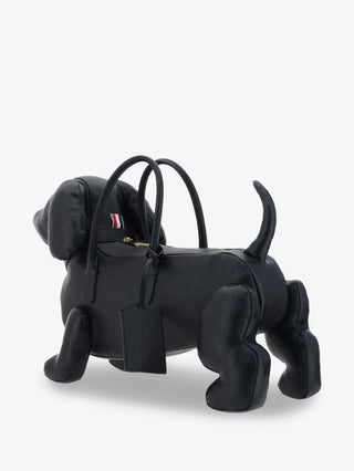 This sculptural Hector bag, inspired by Thom Browne's beloved dachshund, crafted in fine materials and finished with the brand's iconic design codes.