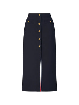 Thom Browne high-waisted midi skirt. Crafted in 100% wool with silk lining, RWB-stripe grosgrain tab and drop-in pockets. Available at our Lisbon store. 