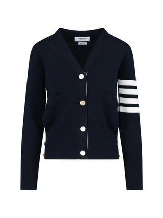 A refined V-neck cardigan from Thom Browne's Milano line. Features buttoned side vents, signature 4-Bar detailing, and a grosgrain loop tab at the back. 