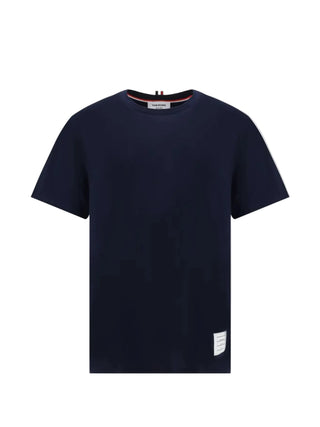 Thom Browne relaxed fit T-shirt. Signature details, premium cotton, and Italian craftsmanship. An iconic everyday staple, available at our Lisbon store.