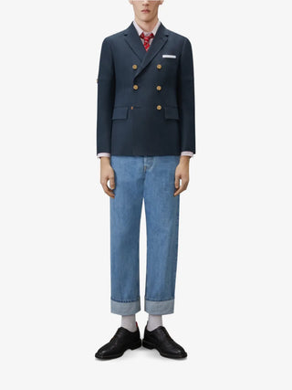 Thom Browne University Stripe Unconstructed Sport Coat. A relaxed, unconstructed silhouette in striped cotton or silk-cotton. Available at our Lisbon store. 
