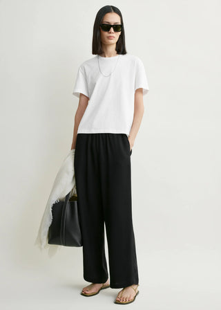 This classic T-shirt features a tonal embroidered monogram at the nape, crew neck, short sleeves and is made from soft organic-cotton jersey. 