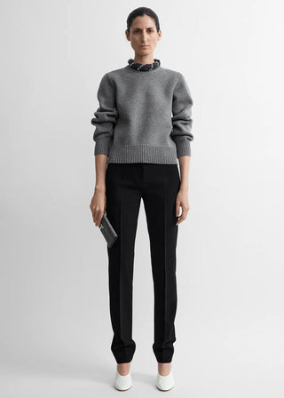 Crew-neck knit with a wide, ribbed hem and subtly rounded sleeves for sculptural volume. Made from a compact merino wool-cotton blend. Available at our Lisbon store. 