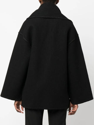 TOTEME embroidered jacket in a wool blend with a scarf and tonal stitching. A boxy silhouette with drop shoulders, patch pockets, and a front button closure.